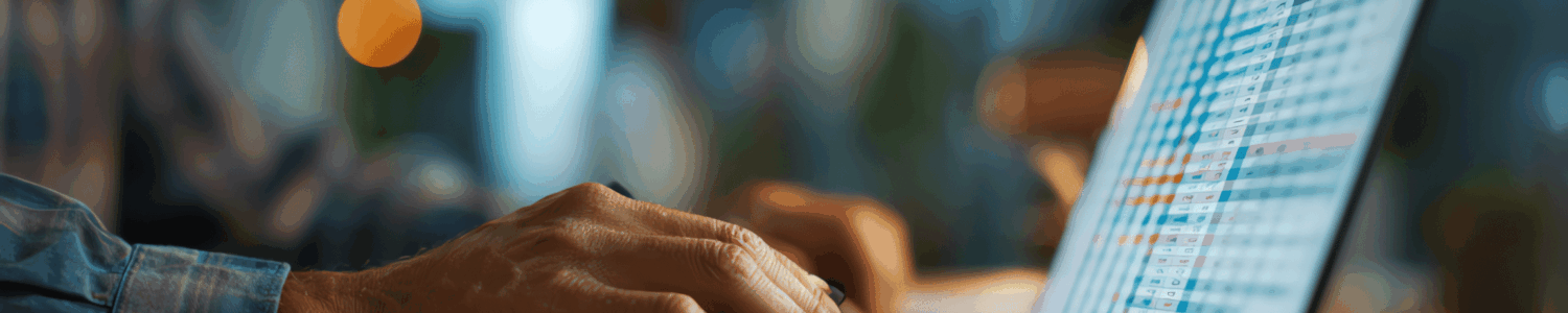 hands on laptop working on bookkeeping